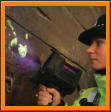 Labino Forensic Light ALS TrAc Finder being used to detect fingerprints by a police officer at a crime scene
